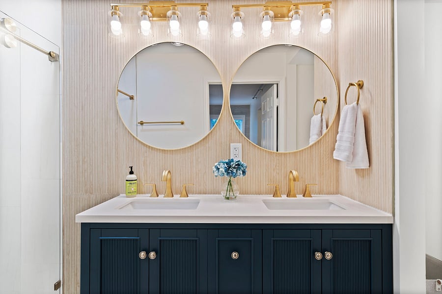 In the primary bathroom, you'll find a beautiful fully remodeled shower, vanity with double sinks, and toilet area which also has extra large doorways to accommodate wheelchairs. 
