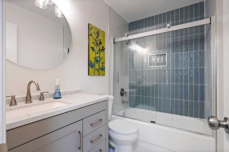 The beautiful, fully remodeled bathroom is conveniently located to all three bedrooms. 