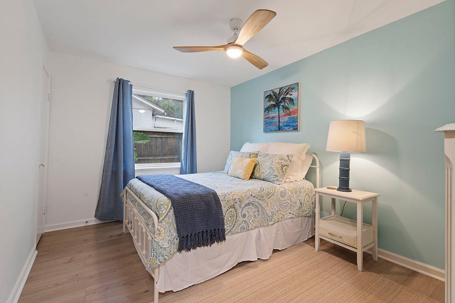 Bedroom number 4 is very serene with a tropical theme. The second full bathroom is located in the hallway close to all three bedrooms. 