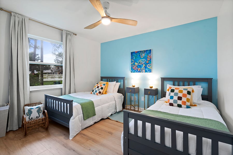 In the twin size bedroom, the room has a youthful feel with bright, cheerful decor, a large dresser and kid's chair for reading. Games and toys are available upon request. 