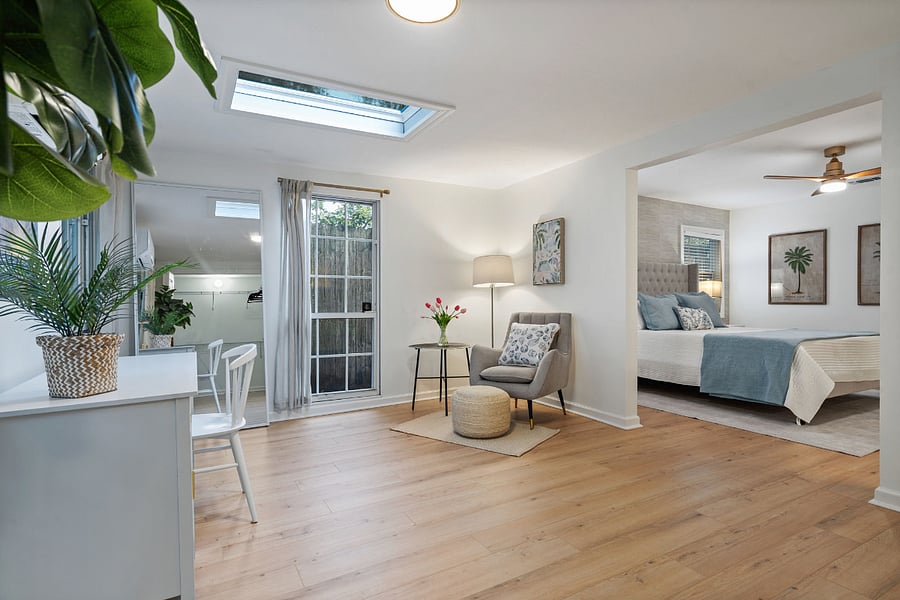 The office off of the primary bedroom serves as a great space to work in peace or simply read and relax. 