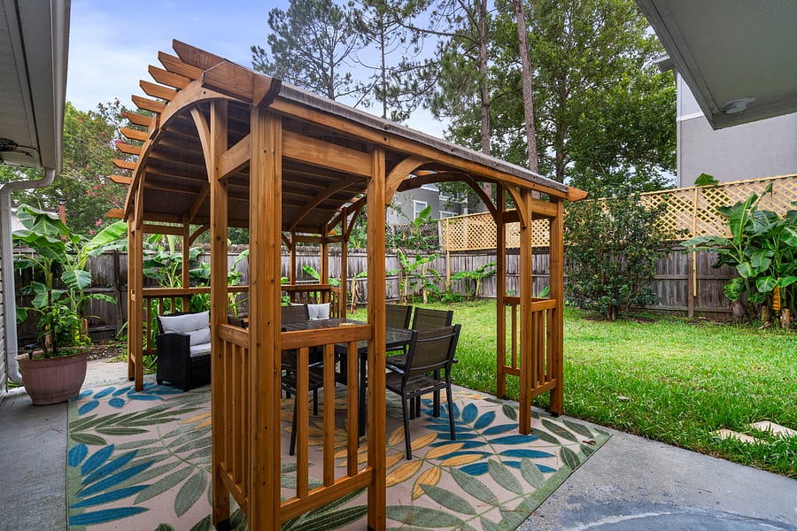 The back patio has a  new, private pergola to enjoy dinner with a peaceful ambiance. 