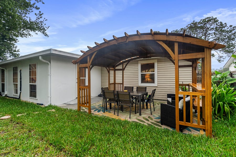 Beautiful pergola on the back patio. Gentle sloping ramp for access to the back patio from the back door of the home. 