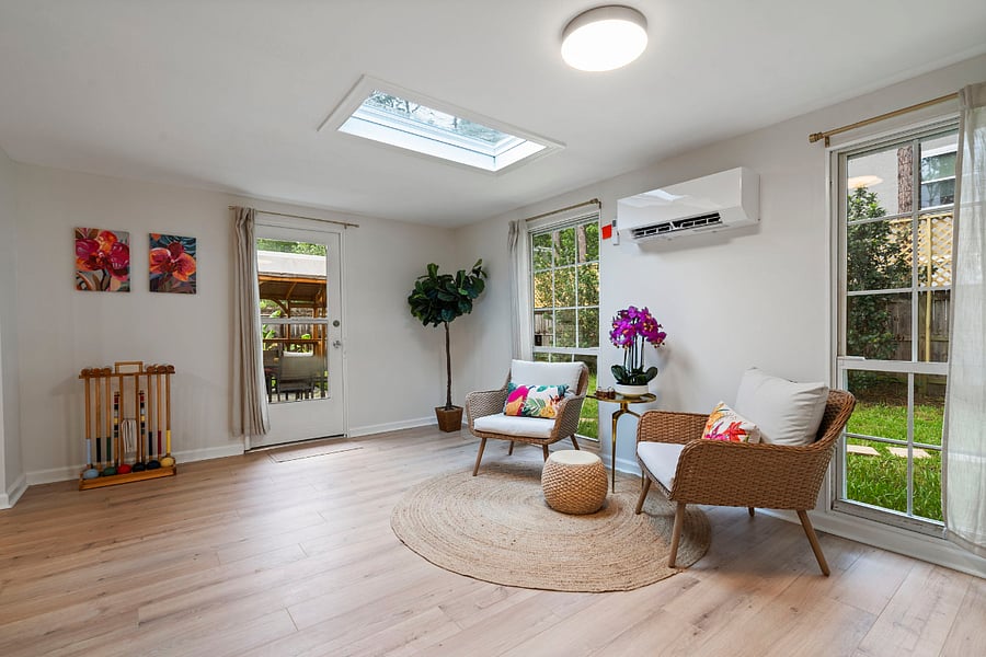 The kitchen and sunroom lead to the back patio and outdoor pergola making it easy to transfer food for an alfresco dinner. 