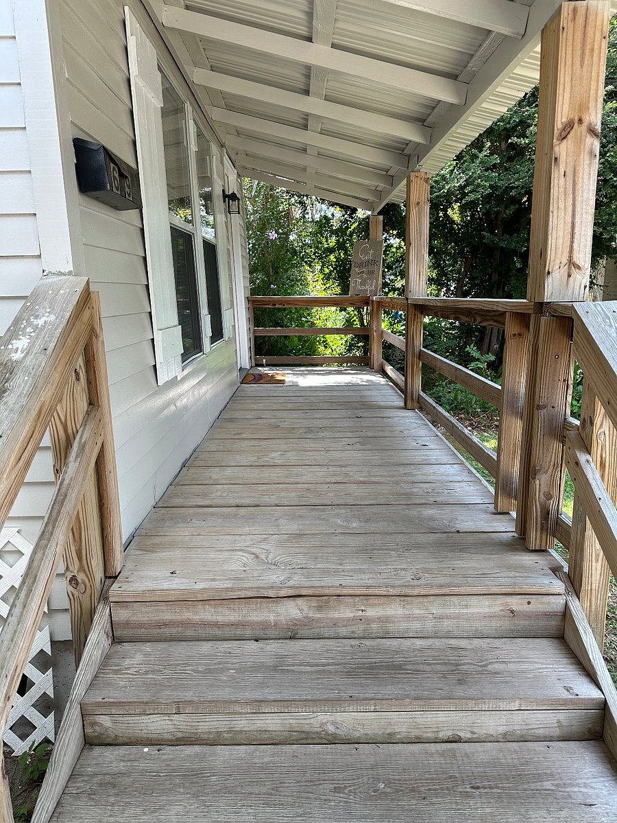 front porch has chairs and table not shown in this picture