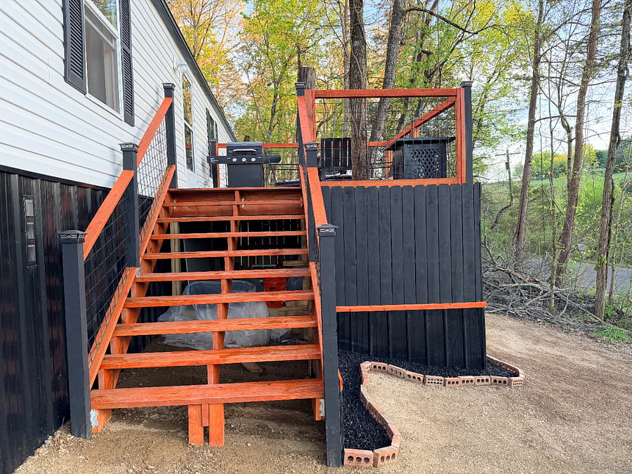 Stairs from the driveway to the deck and front door.