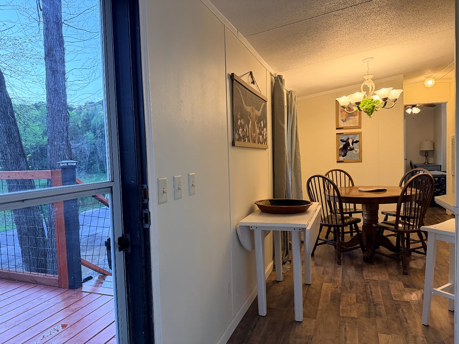 View from the living room to the front door and entrance to the dining room.