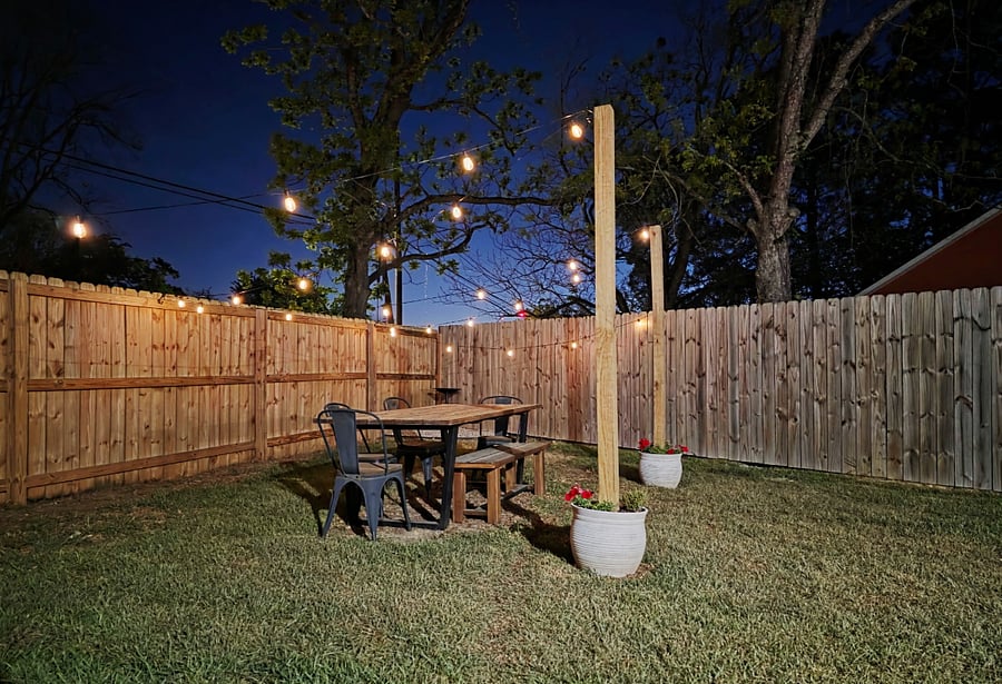 Outdoor space with automatic string lights