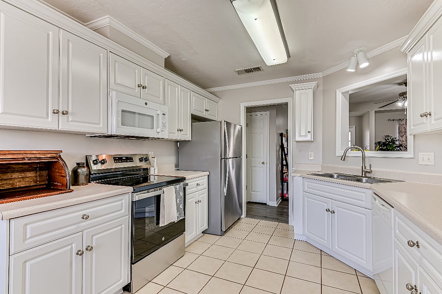Kitchen area with snacks, drinks in the fridge, all utensils needs, and all cooking essentials needs to make your cozy breakfast mornings, and dining pleasant.
