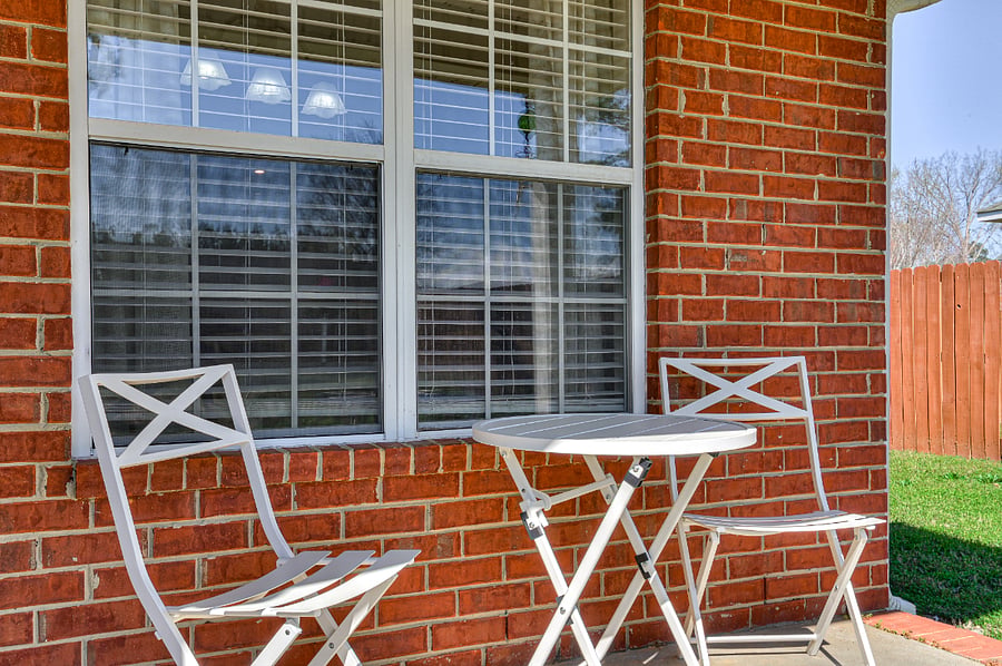 Patio with set of table and chairs.