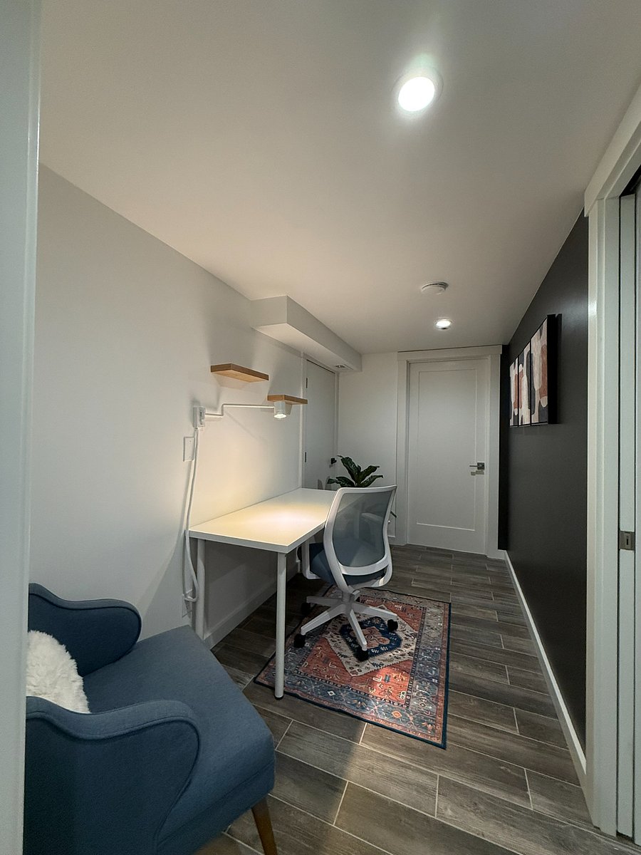Dedicated Office Space and Reading Nook with 55" Desk and 2 shelves.