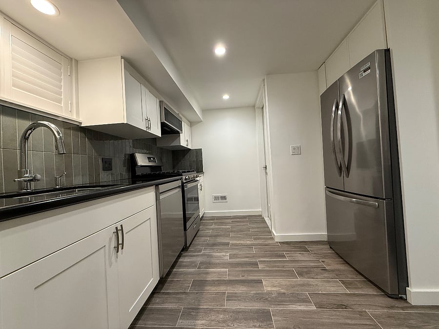 Remodeled kitchen with brand-new, full-size stainless steel appliances.