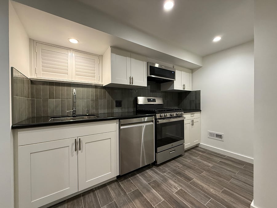 Remodeled kitchen with brand-new, full-size stainless steel appliances.