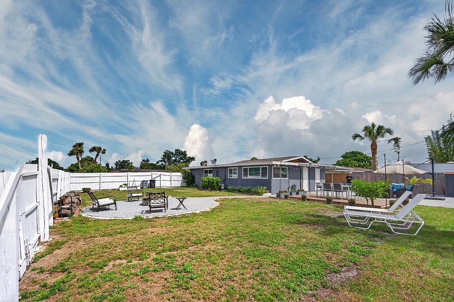 Huge yard & fire pit. Some furnishings are owner-owned and will be removed prior to occupancy. Any items not conveying will be replaced with comparable, high-quality furniture before move-in.
