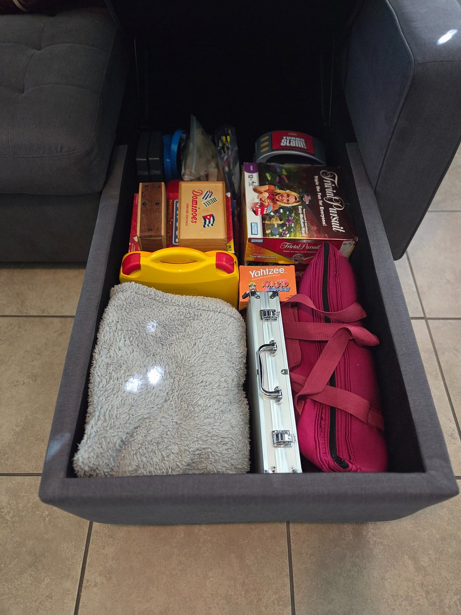 Ottoman with games and throw blankets