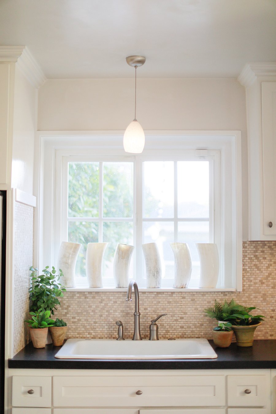 Soft afternoon light through floor-to-ceiling windows in the main living space.