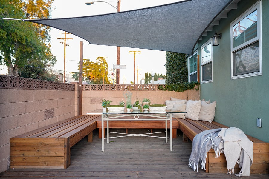 Covered outdoor deck lounge perfect for relaxing or dining outdoors.