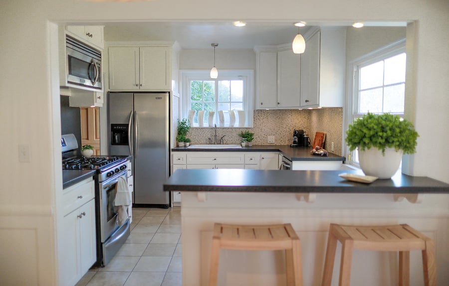 Full chef's kitchen with stainless appliances, gas range, and spacious prep counters.