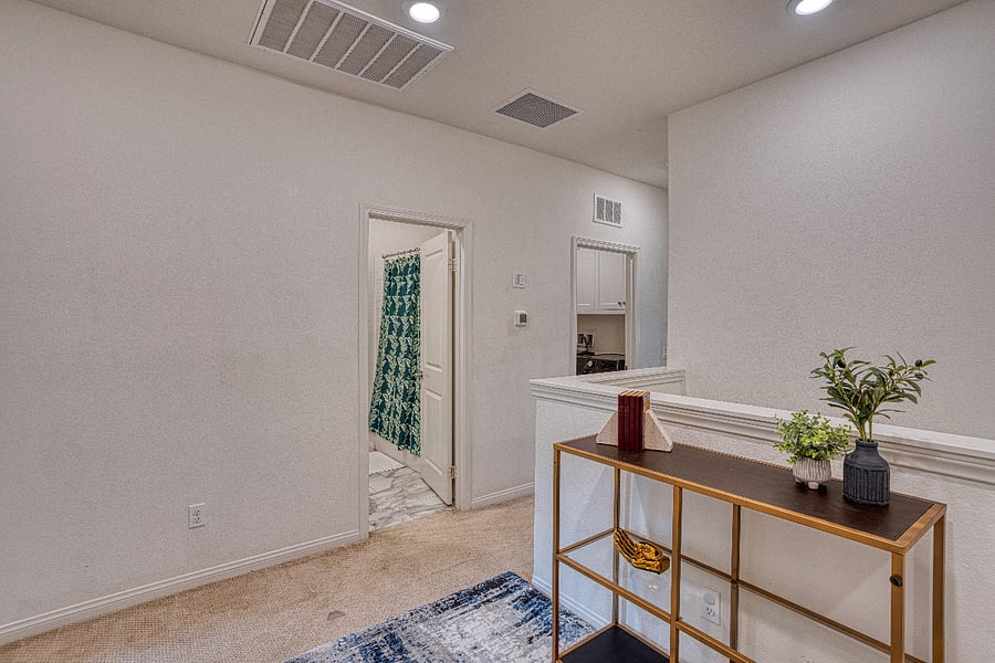 This upper-level landing provides easy access to the guest bedrooms and a full bathroom. The thoughtful layout ensures privacy and convenience for everyone in your group, with clean lines and modern touches throughout the home.