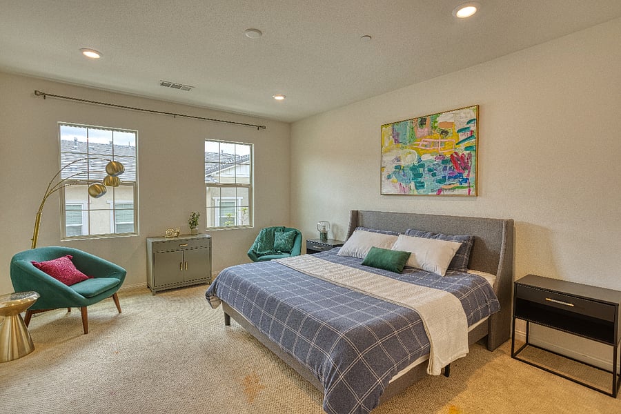 The primary suite features a comfortable king-size bed and plenty of natural light. With designer accents and a cozy reading nook, its the ultimate retreat for a peaceful night's sleep after exploring the city.