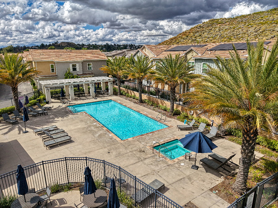 Take a dip in the sparkling community pool or relax in the hot tub. Surrounded by palm trees and stunning mountain views, this resort-style amenity is the perfect spot to soak up the sun and enjoy the beautiful Santa Clarita weather.
