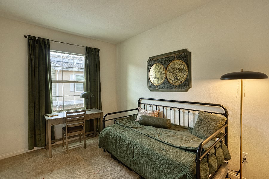 The perfect versatile space! This room features a comfortable daybed and a dedicated desk, making it an ideal quiet workspace or a cozy guest room. Large windows provide plenty of natural light for those working on the go.
