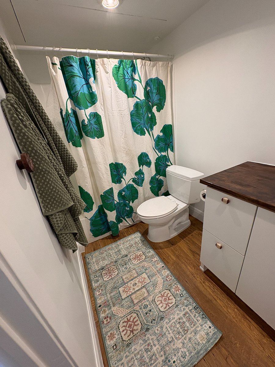 The bathroom floors, toilet, lights, and sink have been replaced. The tub/shower combo have not - they are a typical 1980s.