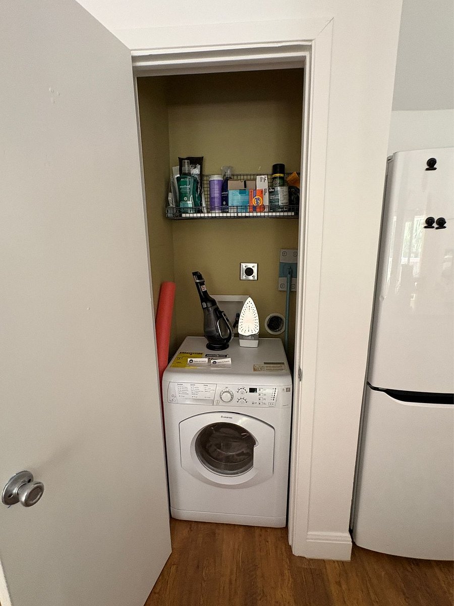On the first floor, next to the kitchen, is a Euro-style all-in-one washer/dryer.