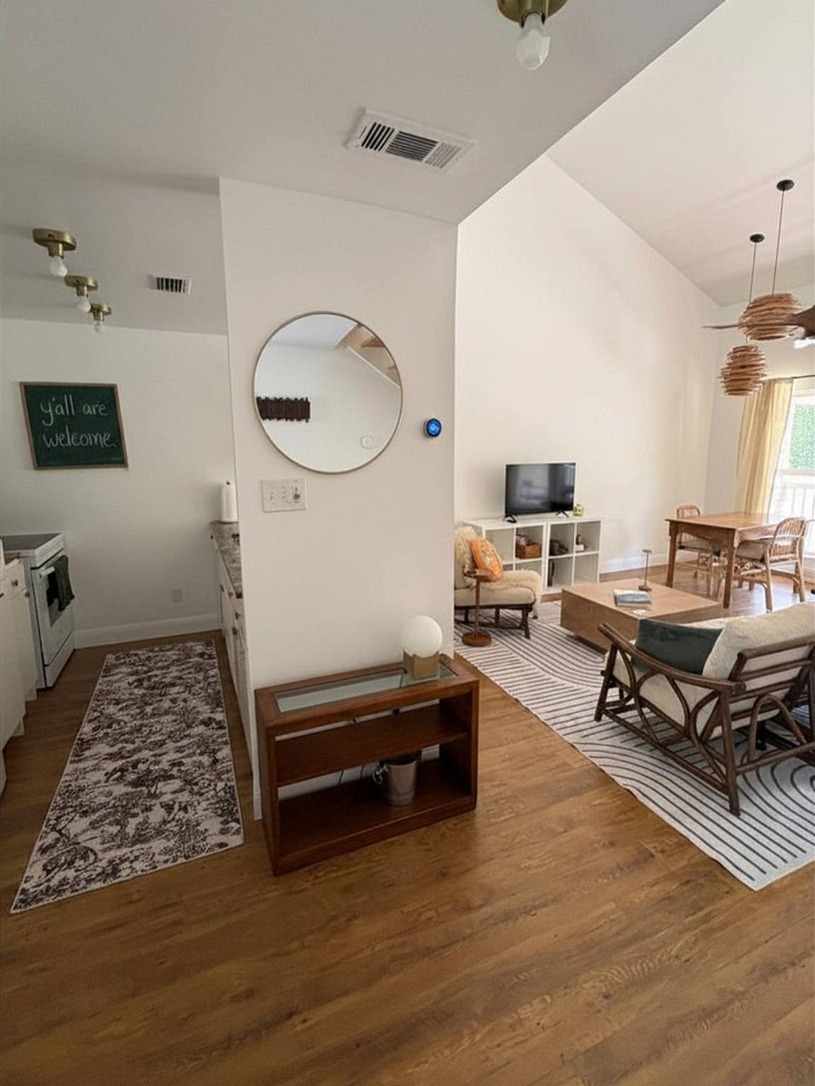 Looking in from the entryway to kitchen and LR. The coffee table top lifts and extends to function as a desktop for working or eating from the sofa.