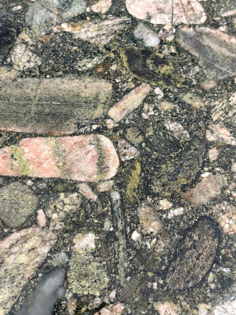 The kitchen's granite natural stone counters are a shout out to Ladybird Lake - with colors found in the water's moss, plants, and stones.