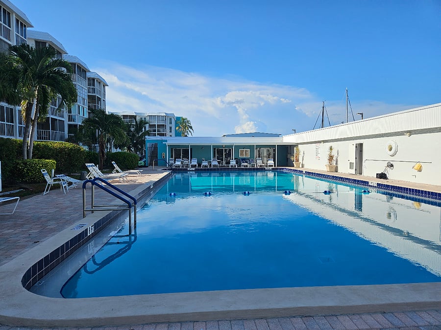 A beautiful half size of an Olympic pool to enjoy. Lounge chairs Tiki Huts with table underneath. Has Club House, grills and restrooms with showers. This is fully fenced, you will need your master key to get in.