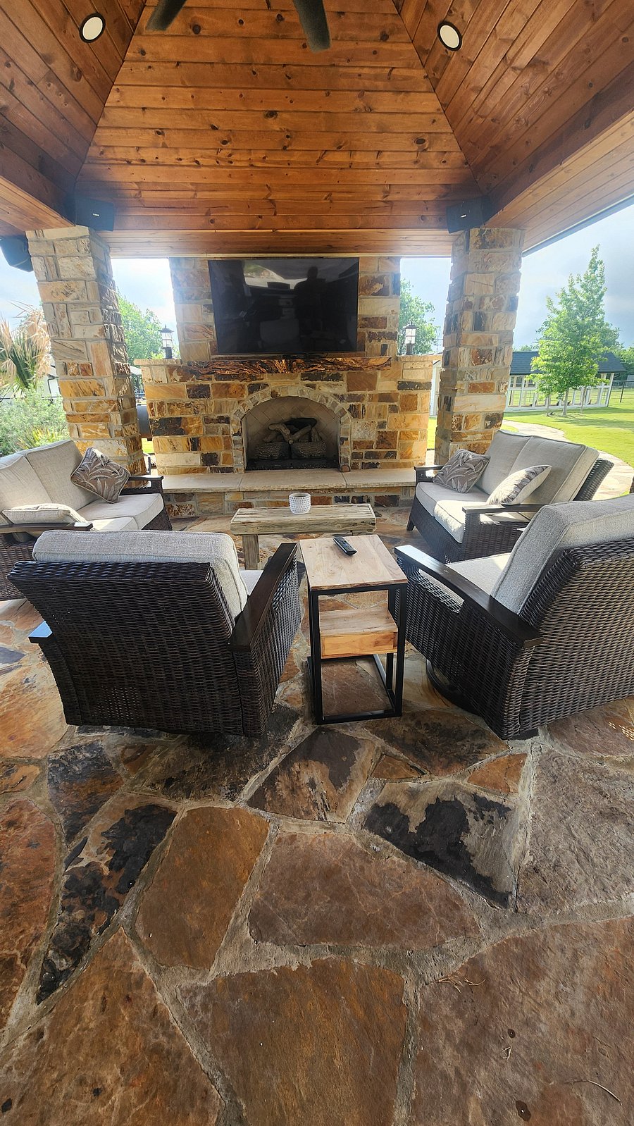 outdoor fireplace and entertainment area