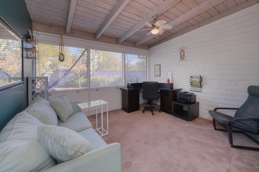 Office space with couch that converts into full bed 