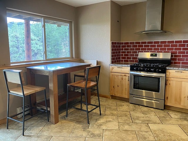 Kitchen with bar table situated to soak in the views.
