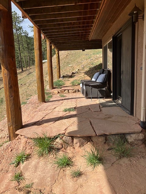 Patio and chairs next to the french door opening to your apartment