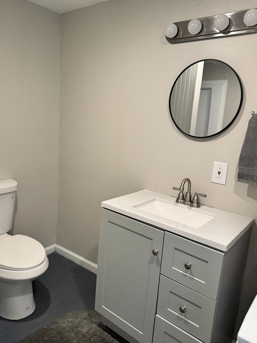 stand up shower, full size stack washer and drier.