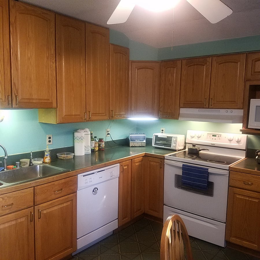 KITCHEN: SINK, STOVE DISHWASHER, CABINETS