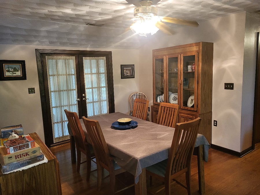 DINING ROOM: TABLE AND CHINA HUTCH