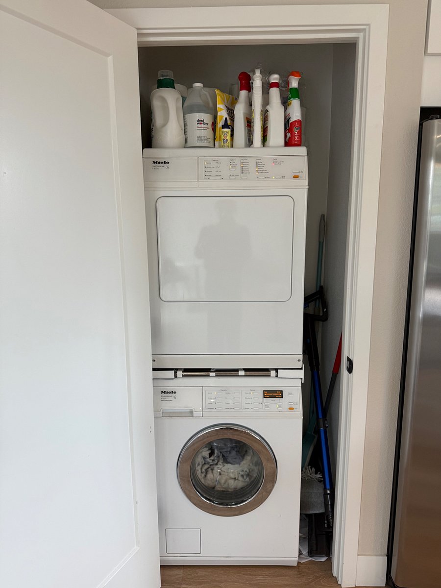 Washer and dryer in closet next to the kitchen.
