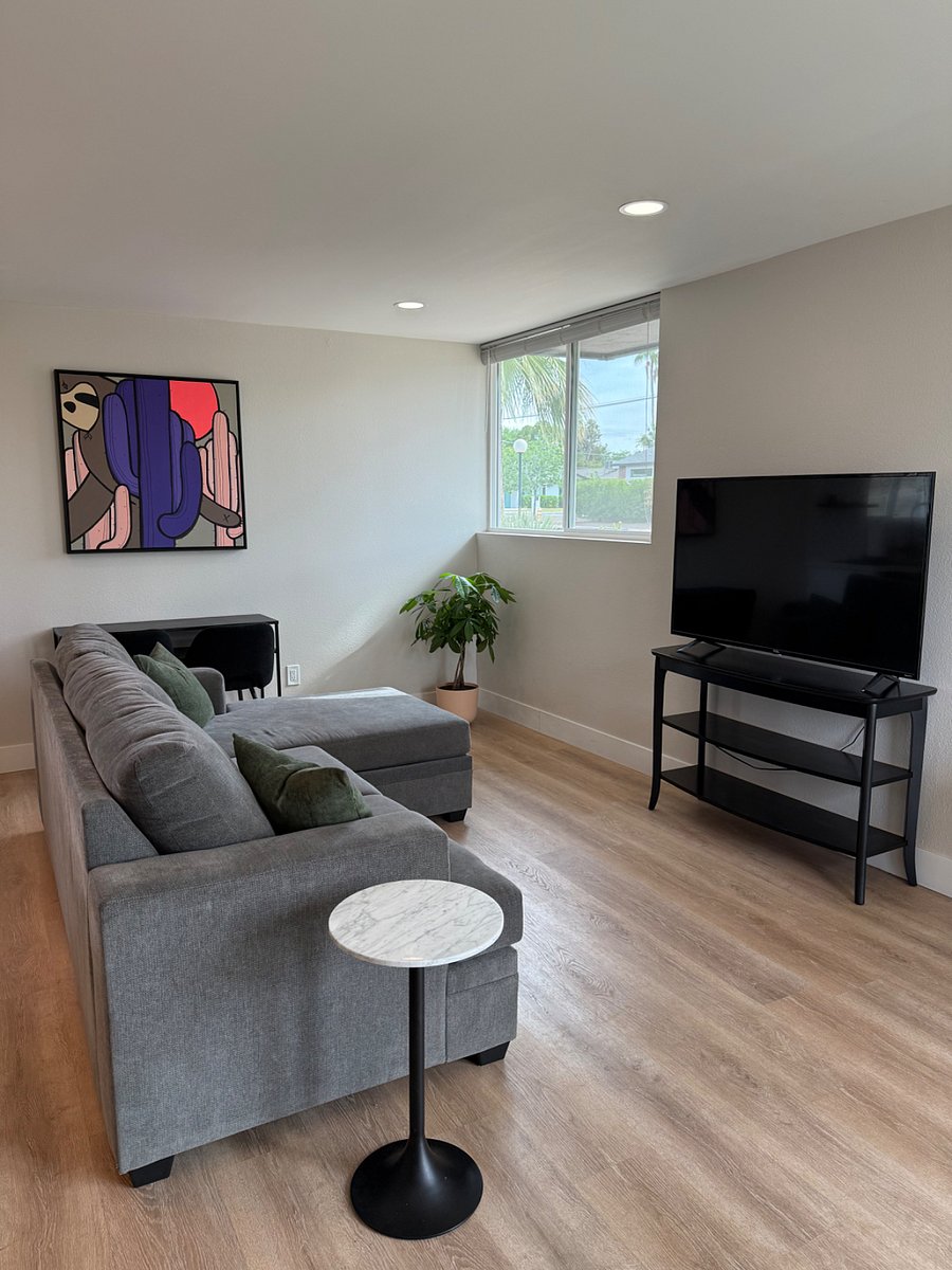 Smart TV and lounging couch for relaxing.