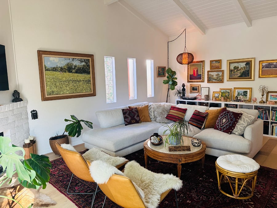 Family room with library and curated artworkFu