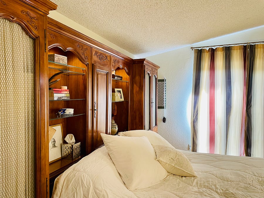 The mesh armoires on both sides of the bed will be locked during your stay. You have a large walk-in closet for your clothing/storage needs.
