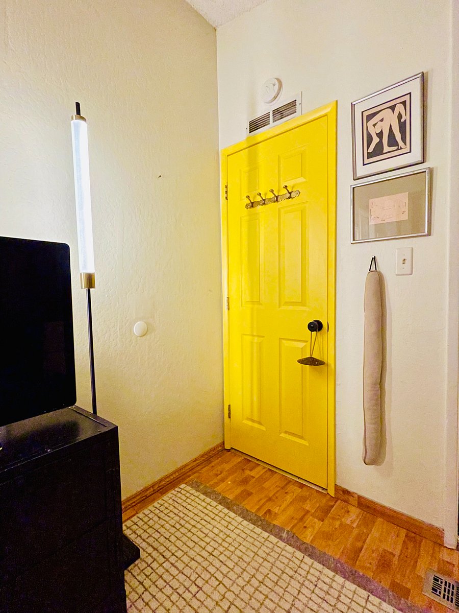 Entry corner of your private bedroom features solid brass hooks behind your door plus a CO and smoke alarm above it.