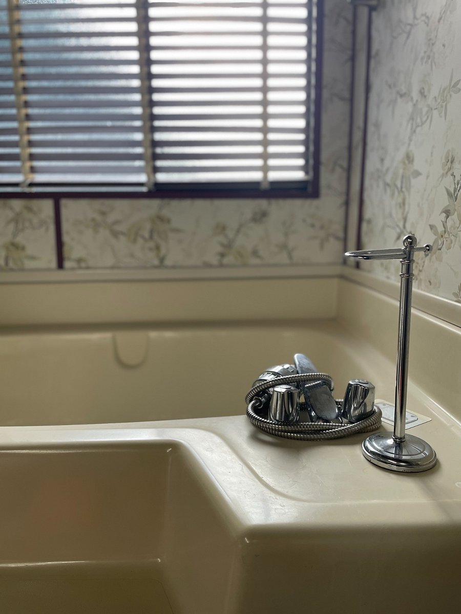 Bathroom windows are fitted with a mosquito netting if you want to keep windows open for ventilation. Tub has a handheld shower attachment.