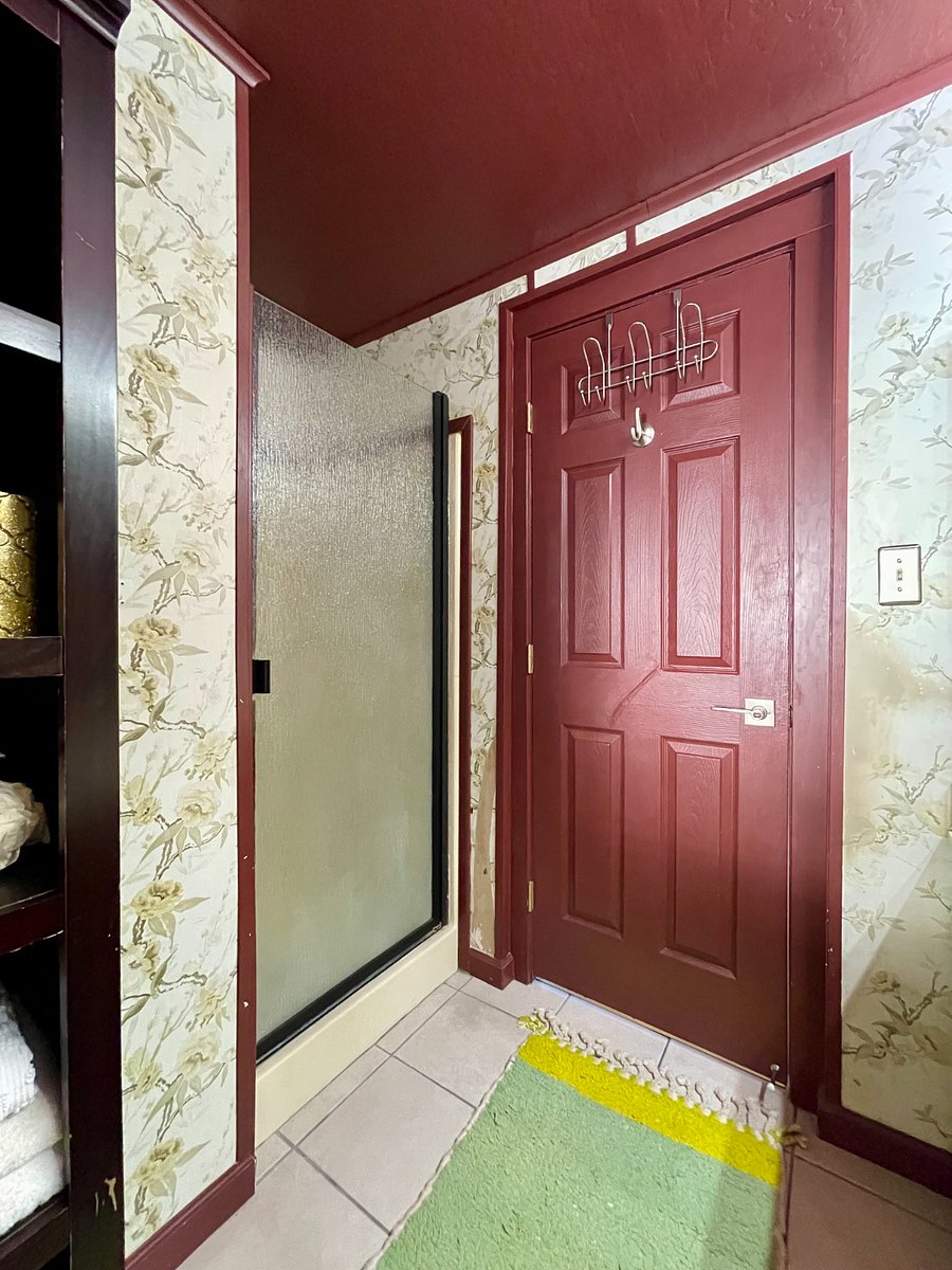 Small standing shower stall (frosted glass door) next to the entrance of your private ensuite bathroom.