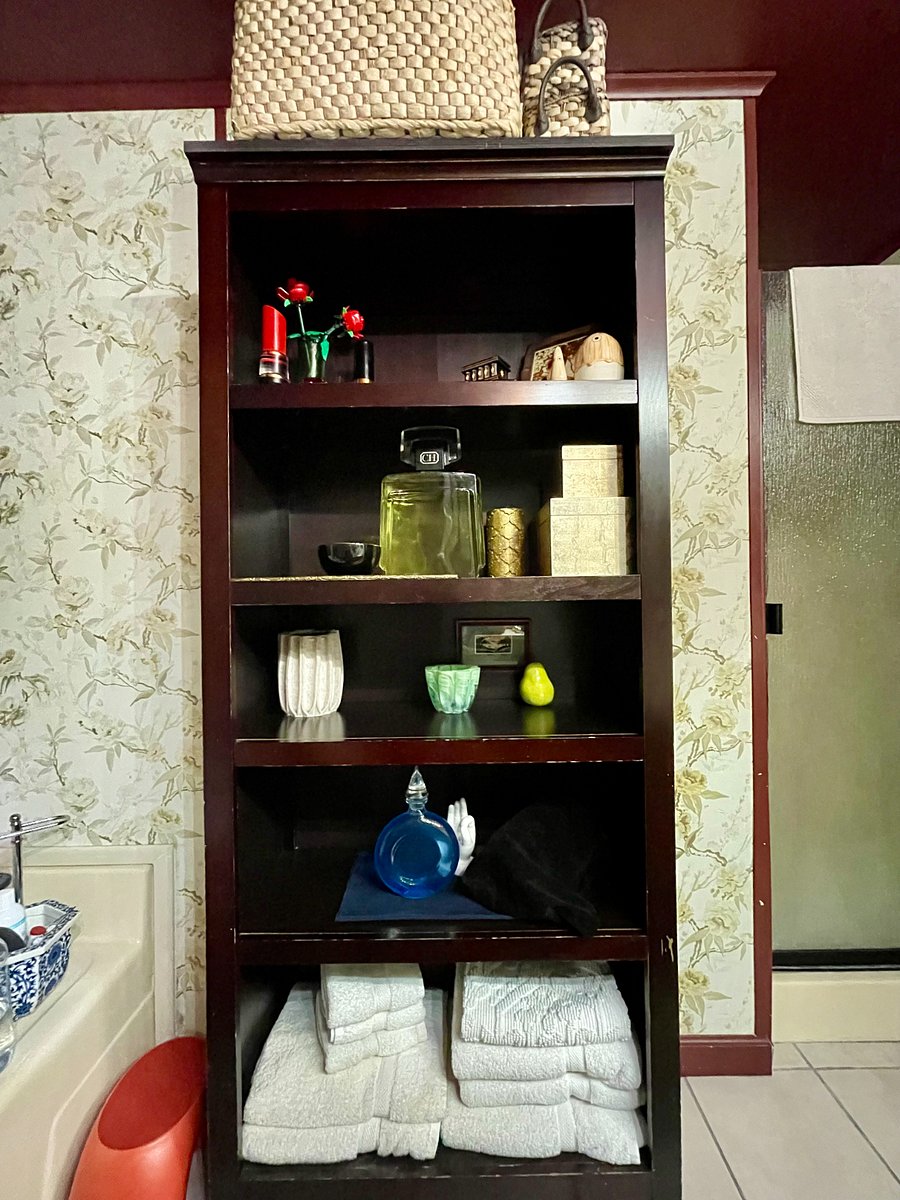 Deep shelves in the bathroom to accommodate your belongings. (Items depicted for scale only shelves will be cleared for your stay.)