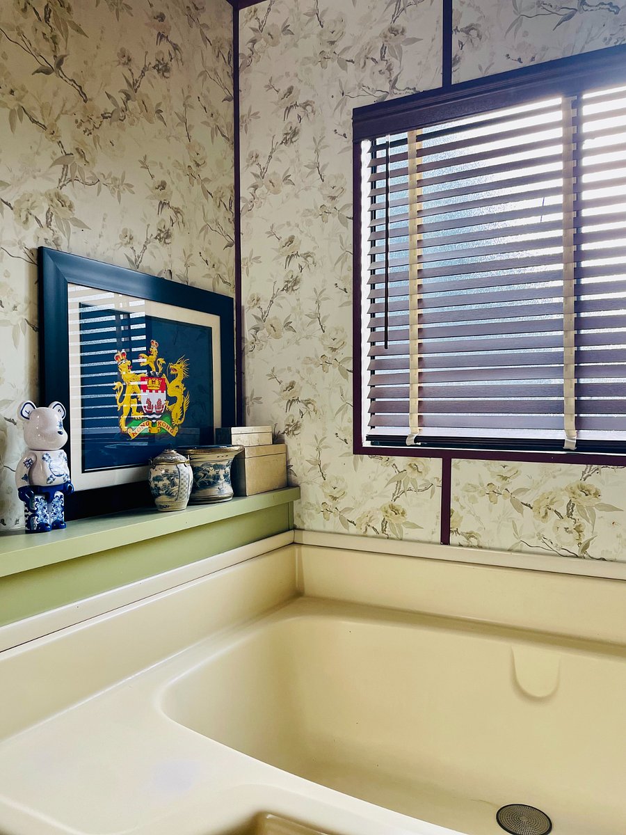 Your ensuite bathroom overlooks the back garden and gets direct sunlight in the late afternoon. Angle blinds upward to keep the room shaded. Glass panes are frosted for privacy but the view/area outside is very private.