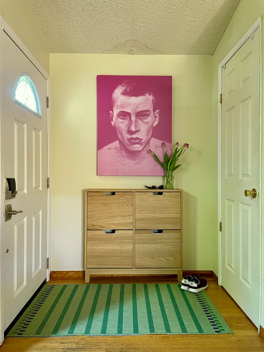 Front door and entry foyer. Find complementary house slippers in these cabinets and return to laundry upon check-out.