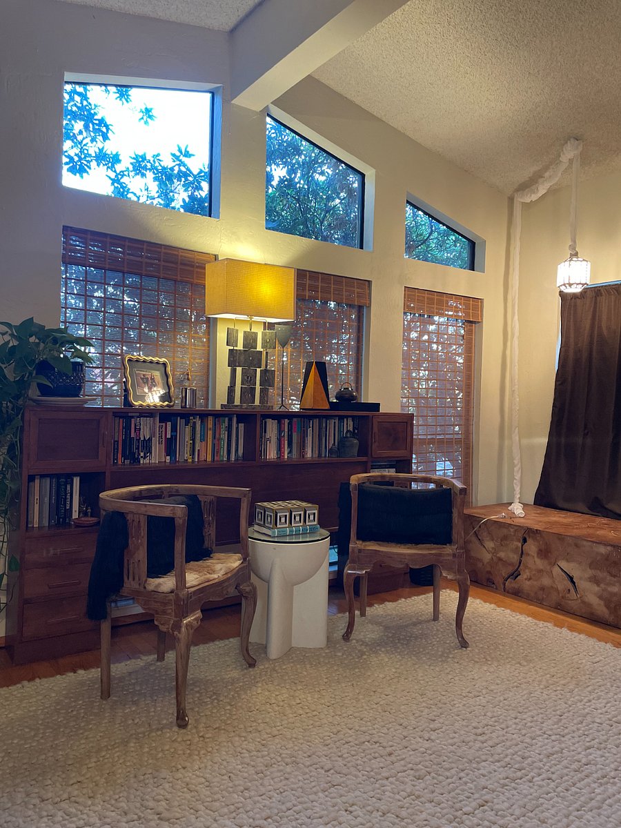 Front room sitting area and shoe bench by the front door.