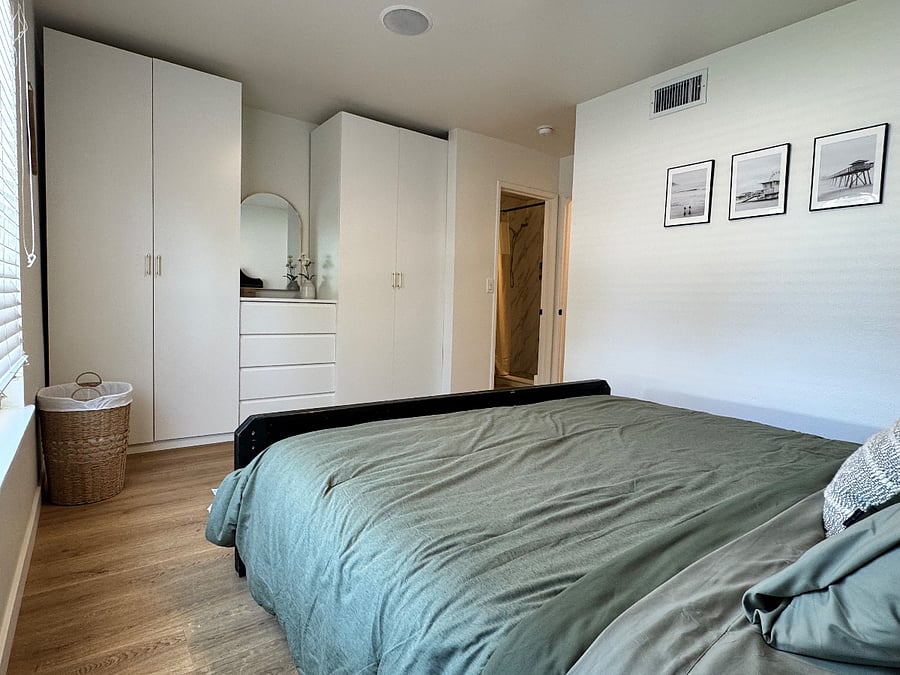 master bedroom with newly built closet and remodeled private bathroom